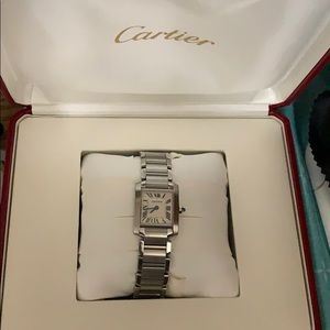 Almost new Cartier tank watch; mint condition.